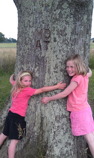 Cousins Hugging Tree